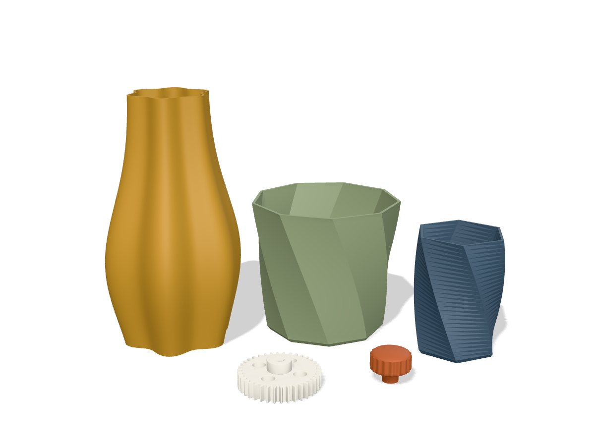 Printed pieces: a tall ochre spiral vase, a sage faceted planter, a slate-blue twisted pen cup, a white mixer gear and a terracotta drawer knob.